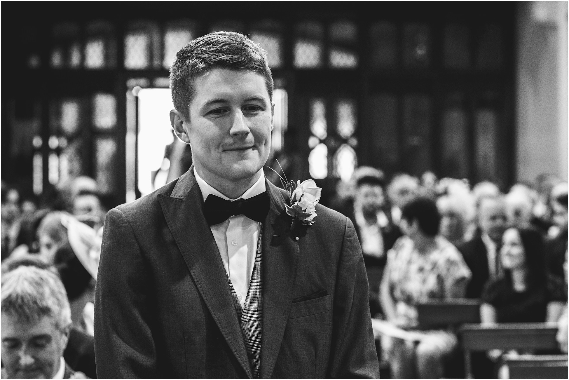 Groom waiting nervously in church